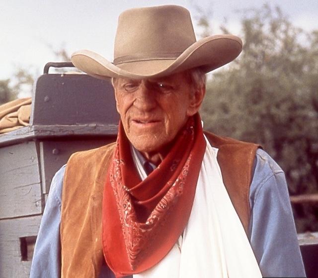 James Arness as Marshal Matt Dillon in his iconic role on Gunsmoke. With his towering presence, Arness became the face of Western justice for over two decades